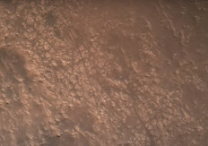 This NASA video frame grab photo released on February 22, 2021 shows the surface of Mars, NASA's Mars 2020 Perseverance mission captured in footage of its rover landing in Mars' Jezero Crater on February 18, 2021, the real footage in this video was captured by several cameras that are part of the rover's entry, descent, and landing suite, the views include a camera looking down from the spacecraft's descent stage (a kind of rocket-powered jet pack that helps fly the rover to its landing site), a camera on the rover looking up at the descent stage, a camera on the top of the aeroshell (a capsule protecting the rover) looking up at that parachute, and a camera on the bottom of the rover looking down at the Martian surface. The US space agency NASA on February 22, 2021 released the first video of the landing of the Perseverance rover on Mars. The video clip, lasting three minutes and 25 seconds, showed the deployment of the parachute and the rover's touchdown on the surface of the Red Planet. "These are really amazing videos," said Michael Watkins, director of NASA's Jet Propulsion Laboratory. "This is the first time we've ever been able to capture an event like the landing on Mars."