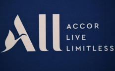 This file photo taken on February 22, 2019 shows a logo of ALL, the loyalty program of Accor group, during a press conference to annonce new shirt sponsorship deal between the PSG and the French multinational Accor, at the Parc des Princes stadium in Paris. French hotel giant Accor announced on February 24, 2021 that it had suffered a net loss of close to 2 billion euros last year, and saw its activity fall by 60 percent due to the health crisis which caused its operations to close or stay idle.