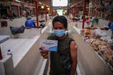 Studies find vaccines working as Indonesians tiptoe around adverse events