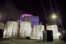 In this file photo taken on June 23, 1990 lights are seen on the front of the nuclear power plant of Saint-Laurent. The French Nuclear Safety Authority (ASN) on February 25, 2021 paved the way for the continued life of France's oldest reactors, 40 to 50 years old, enjoining French electricity company EDF to carry out work to improve their safety.
