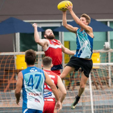 Jack Ahearn catches the AFL football while playing for the Bali Geckos.