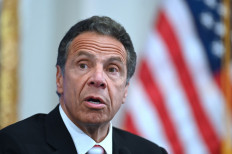 In this file photo Governor of New York Andrew Cuomo speaks during a press conference at the New York Stock Exchange (NYSE) on May 26, 2020 at Wall Street in New York City. 