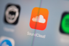 This illustration picture taken on July 24, 2019 in Paris shows the logo of the German music streaming application SoundCloud on the screen of a tablet. 