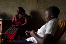 Sofia (right), 19 sits with her mother in their home on the outskirts of Kigali, Rwanda on March 14, 2014. Sofia's mother was raped during the Rwandan Genocide in 1994, and initially had problems growing up without a father. Since receiving counselling, she says 