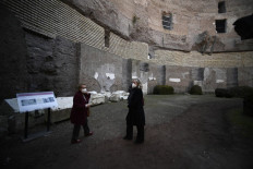 People visit the Mausoleum of Augustus (Mausoleo di Augusto), a large tomb built by the Roman Emperor Augustus in 28 BC on the Campus Martius near the river Tiber, as it reopens on March 03, 2021 in Rome. The Mausoleum of the first Roman Emperor Augustus, which has been closed for fourteen years, is reopening to visitors.