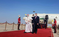 A handout picture released by Iraq's Prime Minister's Media Office on his twitter account shows Prime Minister Mustafa al-Kadhemi welcoming Pope Francis at Baghdad Airport on March 5, 2021. Pope Francis landed in war-battered Iraq on the first-ever papal visit, defying security fears and the pandemic to comfort one of the world's oldest and most persecuted Christian communities. (Agence France Presse/Iraqi Prime Minister's Office).
Usage: 0
