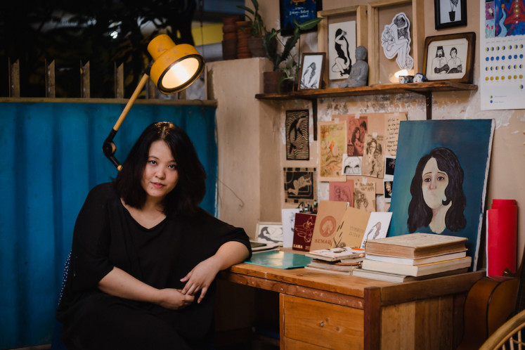 Artist Candrika Soewarno at her desk.