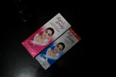 This photo taken on July 8, 2020 shows packages of Unilever "Fair and Lovely" skin-lightening creams on the counter of a shop in New Delhi. Multinationals have long profited from sales of whitening creams, facewash and even vaginal bleaching lotions, by advertising the message that beauty, success and love are only for pale-skinned people. Now, companies like Unilever say they "want to lead the celebration of a more diverse portrayal of beauty".