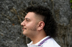 In this file photo taken on May 18, 2019, a man poses during the Mullet haircut festival in Boussu.