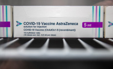 In this file photo taken on January 09, 2021 boxes of vials of the Oxford/AstraZeneca Covid-19 vaccine are seen in a refridgerator at Ashton Gate Stadium in Bristol, one of seven mass vaccination centres which are set to open next week as Britain continues its vaccination programme against Covid-19. D
