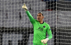 Paris Saint-Germain's Costa Rican goalkeeper Keylor Navas celebrates after saving a penalty kick taken by Barcelona's Argentinian forward Lionel Messi during the UEFA Champions League round of 16 second leg football match between Paris Saint-Germain (PSG) and FC Barcelona at the Parc des Princes stadium in Paris, on March 10, 2021. 