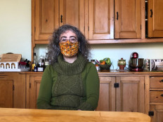 Violaine Cousineau, 47, who suffers from long-term effects of Covid-19, poses at her home on February, 26, 2021 in Montreal, Canada. Difficulties breathing, walking, concentrating: five months after being diagnosed with Covid-19 illness, Canadian Violaine Cousineau -- like many others -- continues to suffer severe persistent symptoms that prevent her from resuming a normal life.
