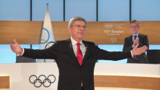 This handout picture taken and released on March 10, 2021 by the International Olympic Committee shows IOC president Thomas Bach reacting after he was re-elected during the 137th IOC Session held virtually in Lausanne. Thomas Bach was on March 10, 2021 re-elected as president of the International Olympic Committee (IOC) for a final four-year term. 