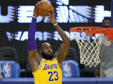 LeBron James #23 of the Los Angeles Lakers goes up for a slam dunk against the Golden State Warriors during the first half of an NBA basketball game at Chase Center on March 15 in San Francisco, California.