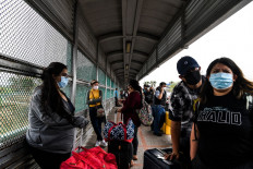 On Texas border, a new migrant rush under Biden