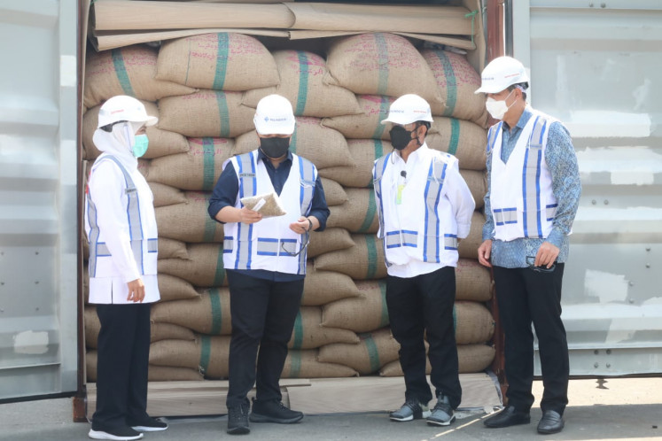 Left to right: East Java Governor Khofifah Indar Parawansa, SOEs Minister Erick Thohir, Agriculture Minister Syahrul Yasin Limpo and Trade Minister Muhammad Lutfi send off ship cargoes carrying various goods including coffee, cloves and bird's nest from Teluk Lamong Terminal in Gresik, East Java,  on March 12, 2021.