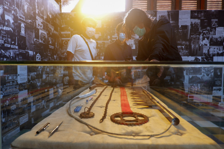 Sickles, chainsaws, motor gear, chains, pistols, and other klitih weapon on display