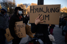 Placards showing the names of victims of the Atlanta shooting are displayed during a 'peace vigil' for victims of Asian attacks, at Union square in New York city on March 19, 2021.
