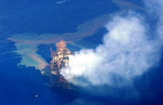 This photo provided by the World Wildlife Fund (WWF) and taken on Sept. 28, 2009, shows oil leaking from the Montara oil rig in the Timor Sea. As many as 28,000 barrels of oil gushed into the Timor Sea off Australia's northern coast in the 10 weeks after the West Atlas oil rig began leaking, raising concerns of an environmental disaster.