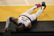 LeBron James #23 of the Los Angeles Lakers reacts to an apparent injury during the second period of a game against the Atlanta Hawks at Staples Center on March 20.