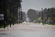 Relentless rains submerge Australian towns for second time in a month