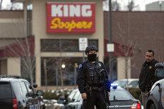 Police officers secure the perimeter of the King Soopers grocery store in Boulder, Colorado on March 22, 2021 after reports of an active shooter. Police swarmed a grocery store in the western US state of Colorado on March 22, 2021, following reports of an active shooter and multiple casualties, law enforcement and eyewitnesses said, with at least one man detained. No details of casualties have been confirmed, but Colorado governor Jared Polis and Boulder Mayor Sam Weaver each referred to the incident as a 