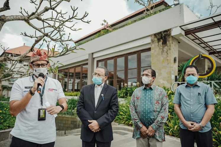 Tourism and Creative Economy Minister Sandiaga Salahuddin Uno (left) speaks at a press conference alongside Indian Ambassador to Indonesia Manoj Kumar Bharti (second left), following their meeting on March 17, 2021 at Inaya Putri Bali resort in Nusa Dua, Bali.