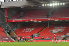 Liverpool's Scottish defender Andrew Robertson looks on after the final whistle of the English Premier League football match between Liverpool and Fulham at Anfield in Liverpool, north west England on March 7, 2021. Fulham won the game 1-0.
