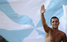 A Lazio supporter cheers during their Serie A football match against Brescia in Rome's Olympic Stadium on October 3, 2010.