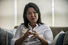 Peruvian leader of the Fuerza Popular (Popular Force) party and daughter of imprisoned former Peruvian President (1990-2000) Alberto Fujimori, Keiko Fujimori, gestures as she speaks during an interview with AFP at her home in Lima on March 19.