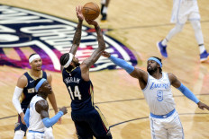 Brandon Ingram #14 of the New Orleans Pelicans shoots over Wesley Matthews #9 of the Los Angeles Lakers during the third quarter of an NBA game at Smoothie King Center on March 23 in New Orleans, Louisiana. 