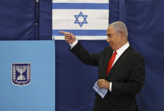 Israeli Prime Minister Benjamin Netanyahu gestures as he votes at a polling station in Jerusalem on March 23, 2021 in the fourth national election in two years.

