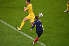 France's forward Antoine Griezmann scores a goal during the FIFA World Cup Qatar 2022 qualification football match between France and Ukraine at the Stade de France in Saint-Denis, outside Paris, on March 24.