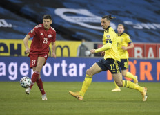 Sweden's forward Zlatan Ibrahimovic and Georgia's defender Lasha Dvali vie for the ball during the FIFA World Cup Qatar 2022 qualification football match Sweden v Georgia in Solna, near Stockholm on March 25.