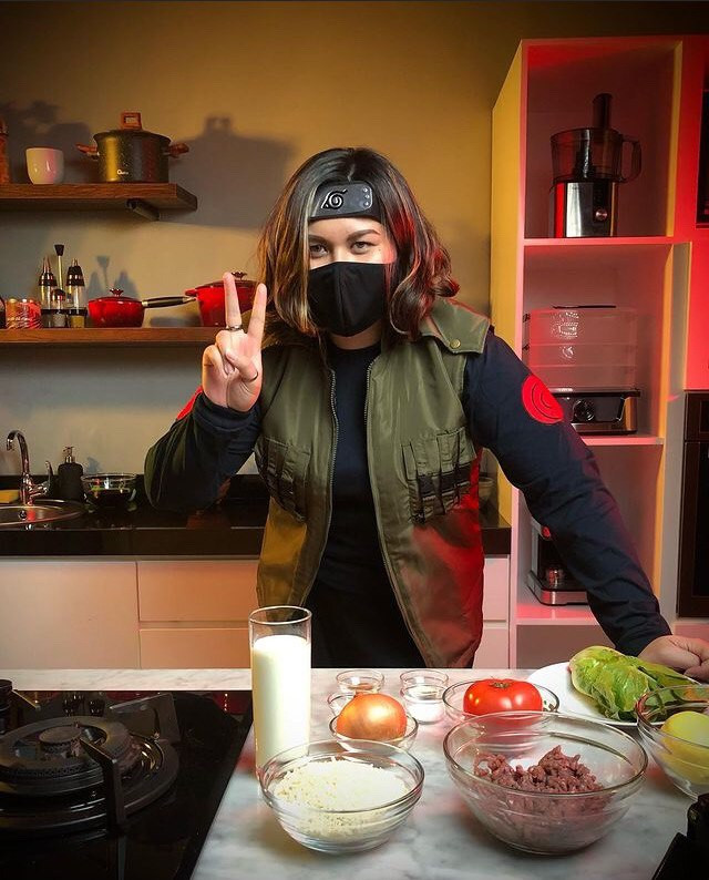 Stacey cooking in her ninja gear