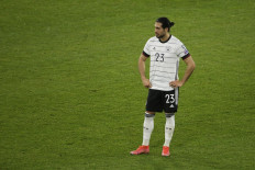 Germany's midfielder Emre Can reacts after the FIFA World Cup Qatar 2022 qualification football match Germany v North Macedonia in Duisburg, western Germany on March 31, 2021.

