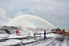 Firefighters battle a fire at Balongan refinery, operated by state oil company Pertamina, in Indramayu, West Java on March 31, 2021. 