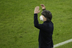 Germany's coach Joachim Loew reacts from the sidelines during the FIFA World Cup Qatar 2022 qualification football match Germany v North Macedonia in Duisburg, western Germany on March 31, 2021.

