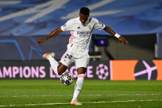 Real Madrid's Brazilian forward Vinicius Junior controls the ball just before scoring a goal during the UEFA Champions League first leg quarter-final football match between Real Madrid and Liverpool at the Alfredo di Stefano stadium in Valdebebas in the outskirts of Madrid on April 6, 2021.
