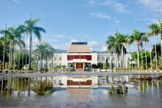 The Presidential Palace is reflected in water in Dili on April 6, 2021, after Tropical Cyclone Seroja battered the Southeast Asian nation, killing dozens and leaving thousands homeless.
