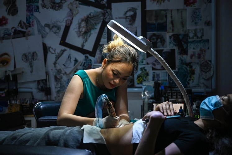 In her tiny Hanoi apartment, tattoo artist Ngoc inks middle-aged women whose lives have been upended by divorce or illness, each of them searching for healing through an art form that is still largely taboo in Vietnam.