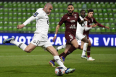Lille's Turkish forward Burak Yilmaz shoots and scores a goal during the French L1 football match between Metz (FC Metz) and Lille (LOSC) at Saint Symphorien stadium in Longeville-les-Metz, eastern France, on April 9, 2021.