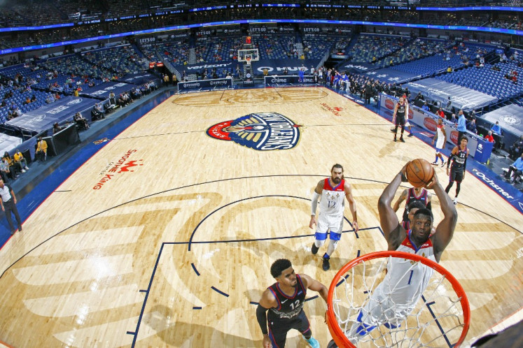 Zion Williamson #1 of the New Orleans Pelicans drives to the basket against the Philadelphia 76ers on April 9, 2021 at Smoothie King Center in New Orleans, Louisiana.