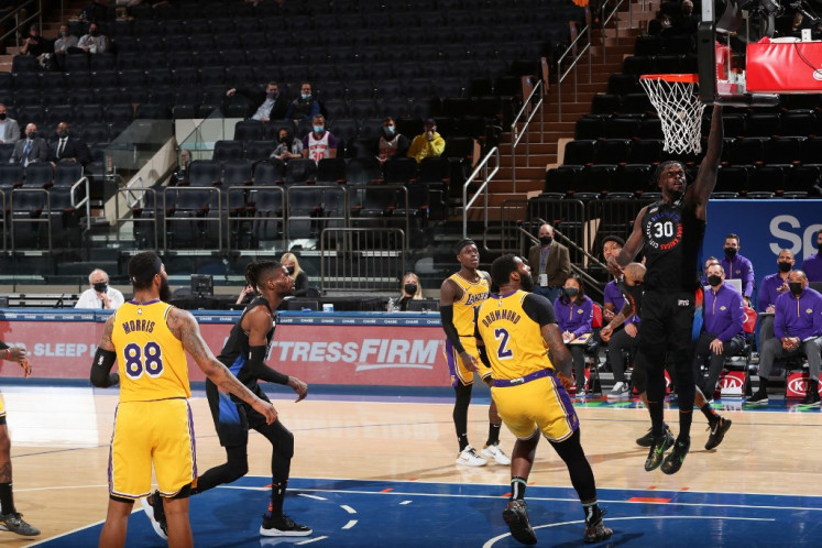 Julius Randle #30 of the New York Knicks drives to the basket during the game against the Los Angeles Lakers on April 12, 2021 at Madison Square Garden in New York City, New York. 