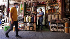 A vendor sets up a display at a spice shop at a market in Dubai in the United Arab Emirates ahead of the Muslim fasting month of Ramadan, on April 12, 2021. 