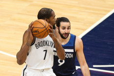 Kevin Durant #7 of the Brooklyn Nets and Ricky Rubio #9 of the Minnesota Timberwolves compete in the first quarter of the game at Target Center on April 13, 2021 in Minneapolis, Minnesota.
