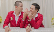 Shocked by Indonesia: Suriya Kertsang, 28 (R), and his partner Suriya Manusonth, 24, received verbal harassment and  death threats from Indonesian internet users after posting pictures of their commitment ceremony on Kertsang's Facebook account. 