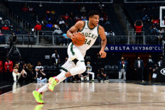 Giannis Antetokounmpo #34 of the Milwaukee Bucks dribbles the ball during the game against the Atlanta Hawks on April 15, 2021 at State Farm Arena in Atlanta, Georgia.