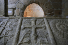 The cross of the Knights Templar engraved on the 14th century sarcophagus of Adam de Antiochia, Marshal of Cyprus, is pictured on January 22, 2021 on the site where a chapel of the Knights Templar was built at the Limassol medieval castle, now housing the Cyprus Medieval Museum in the coastal Cypriot city. Fables of the Knights Templar are legend, but deep beneath a castle on Cyprus -- an island once owned by the Crusader brotherhood -- lies a legacy historians say still resonates today. Down narrow, uneven and steep stone stairs in the fort of the Mediterranean port city of Limassol, in a low-vaulted room lined with tombstones of medieval knights, is the chapel where England's King Richard the Lionheart is believed to have been married, en route to the Crusades in 1192.