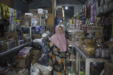 Ready to live in darkness: Villagers around Kediri's new airport say they'll never leave